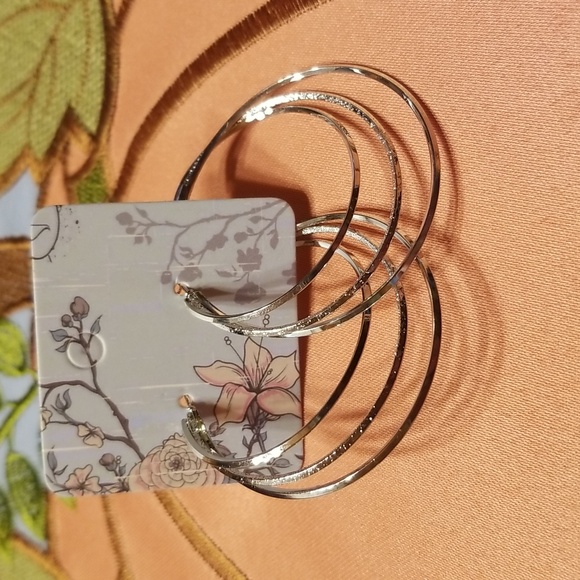 New large silver hoop earrings. - Picture 1 of 6